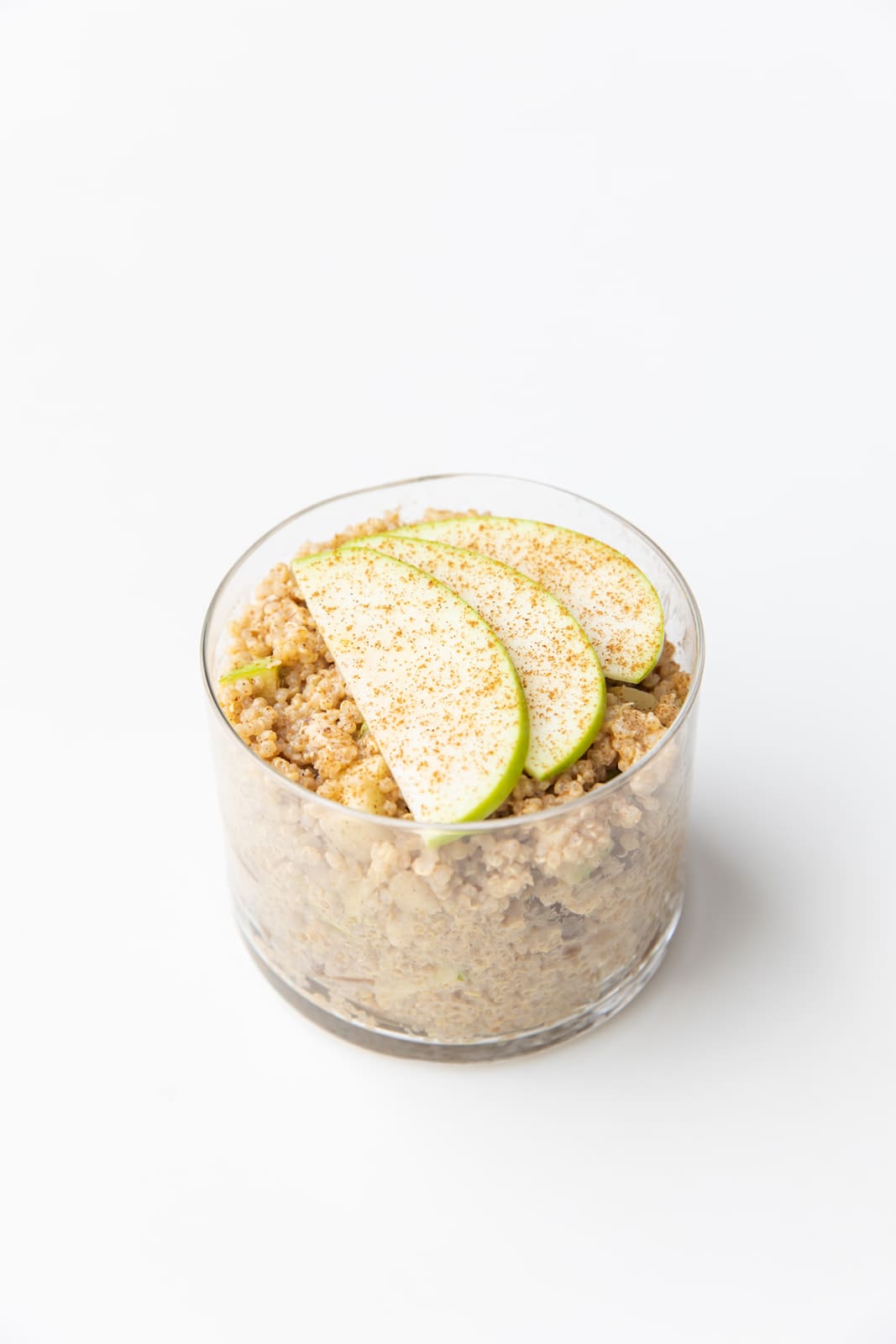 Oat bowl topped with fresh berries and nut butter